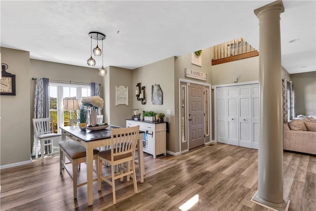 245 Shaw Ct, Salem Twp Wml, PA 15670 - dining area featuring wood finished floors and decorative columns