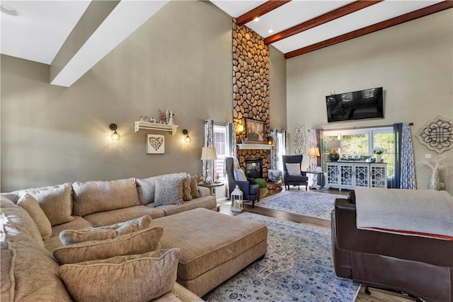 245 Shaw Ct, Salem Twp Wml, PA 15670 - living room featuring high vaulted ceiling, wood finished floors, beam ceiling, and a stone fireplace