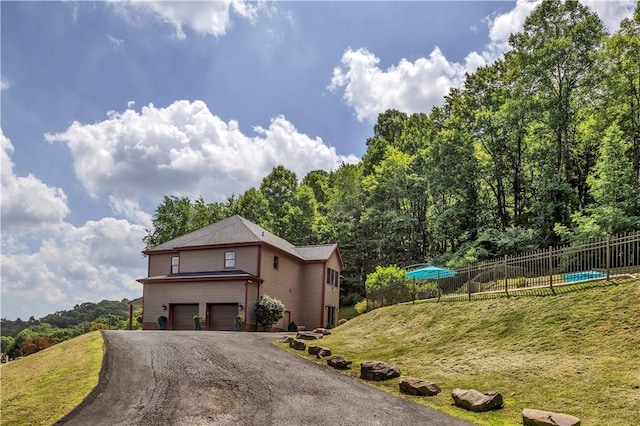 245 Shaw Ct, Salem Twp Wml, PA 15670 - view of front of home with an attached garage and asphalt driveway