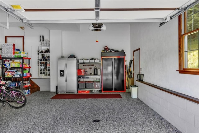 245 Shaw Ct, Salem Twp Wml, PA 15670 - garage featuring stainless steel fridge and a garage door opener