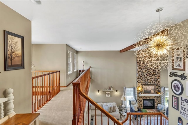 245 Shaw Ct, Salem Twp Wml, PA 15670 - corridor with a chandelier, carpet floors, and an upstairs landing