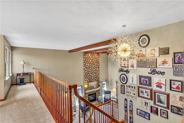 245 Shaw Ct, Salem Twp Wml, PA 15670 - hallway with a chandelier, an upstairs landing, carpet flooring, and beamed ceiling