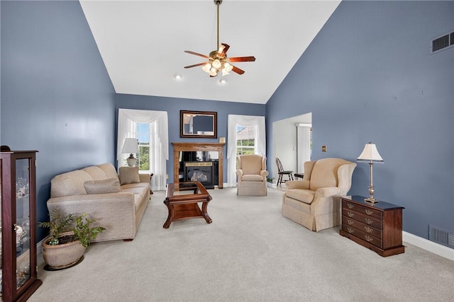 260 Arrowhead Ln, Nottingham, PA 15330 - carpeted living room with high vaulted ceiling, ceiling fan, and a glass covered fireplace