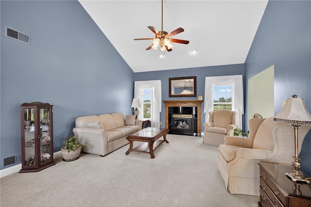 260 Arrowhead Ln, Nottingham, PA 15330 - living area featuring high vaulted ceiling, a ceiling fan, light colored carpet, and a fireplace with flush hearth
