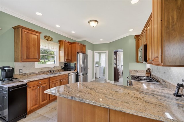 260 Arrowhead Ln, Nottingham, PA 15330 - kitchen featuring appliances with stainless steel finishes, washing machine and clothes dryer, recessed lighting, light tile patterned floors, and tasteful backsplash