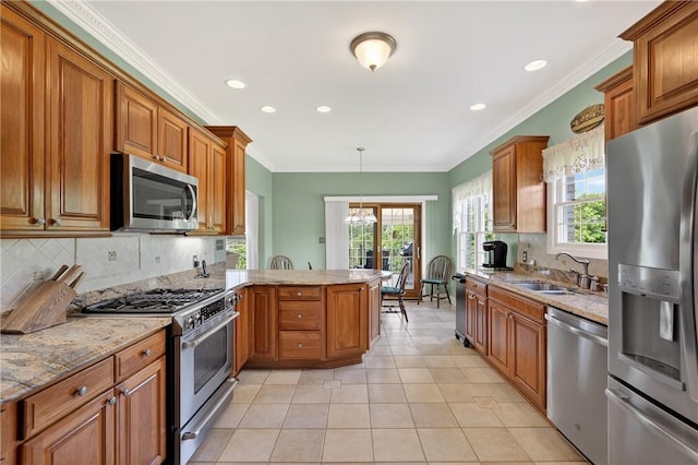 260 Arrowhead Ln, Nottingham, PA 15330 - kitchen with appliances with stainless steel finishes, a peninsula, tasteful backsplash, brown cabinetry, and ornamental molding