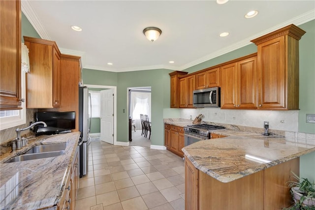 260 Arrowhead Ln, Nottingham, PA 15330 - kitchen with stainless steel appliances, tasteful backsplash, a peninsula, brown cabinetry, and recessed lighting