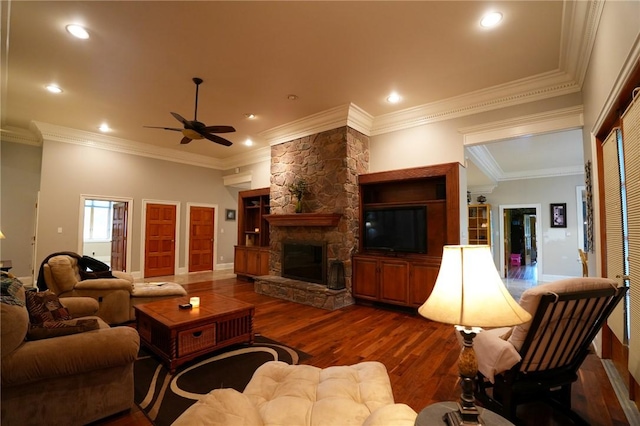 434 Bocktown Cork Rd, Independence Bea, PA 15026 - living room with wood finished floors, a ceiling fan, crown molding, a stone fireplace, and recessed lighting