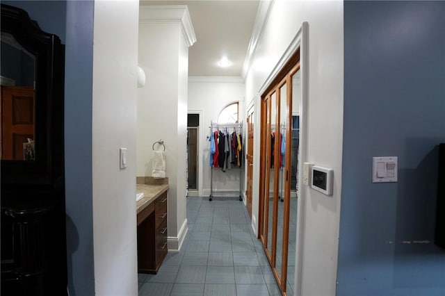 434 Bocktown Cork Rd, Independence Bea, PA 15026 - bathroom featuring crown molding, vanity, and a walk in closet