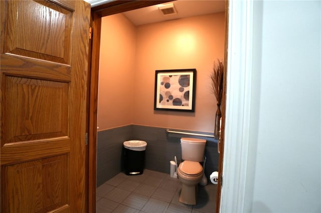 434 Bocktown Cork Rd, Independence Bea, PA 15026 - bathroom with wainscoting, tile patterned flooring, and tile walls