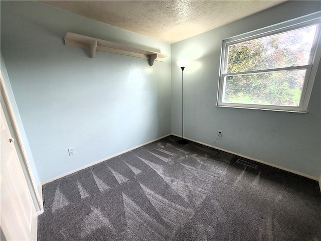 314 Wren Dr, Hempfield Twp Wml, PA 15601 - unfurnished room featuring dark colored carpet and a textured ceiling