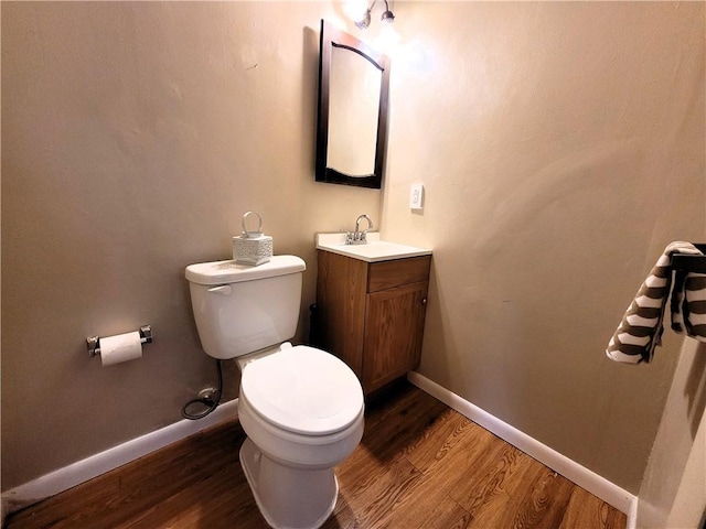 314 Wren Dr, Hempfield Twp Wml, PA 15601 - half bathroom featuring wood finished floors and vanity