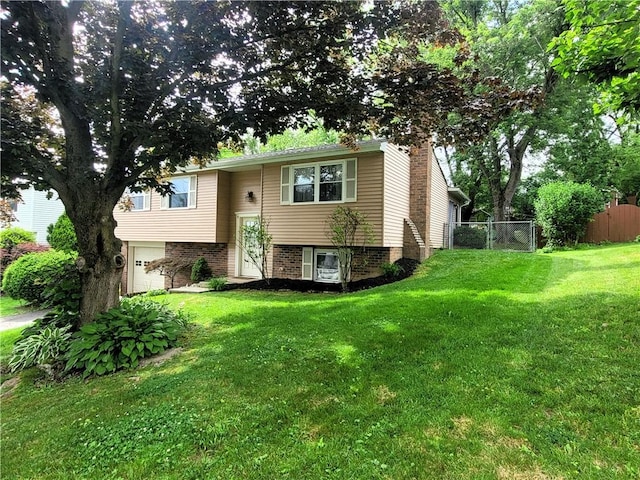 314 Wren Dr, Hempfield Twp Wml, PA 15601 - raised ranch featuring a garage and a chimney