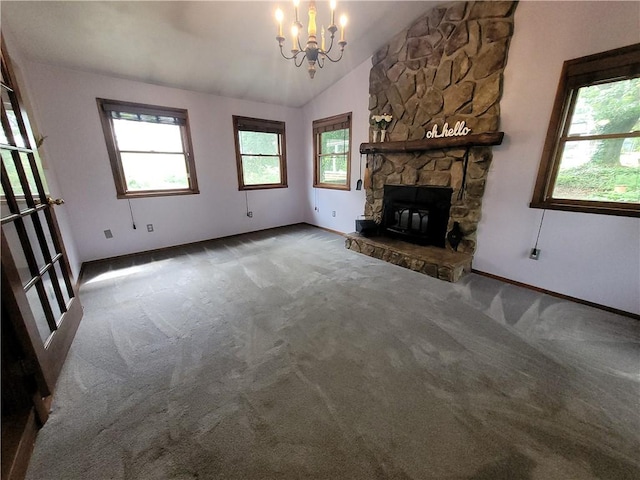 314 Wren Dr, Hempfield Twp Wml, PA 15601 - unfurnished living room featuring carpet flooring, lofted ceiling, a chandelier, and a stone fireplace