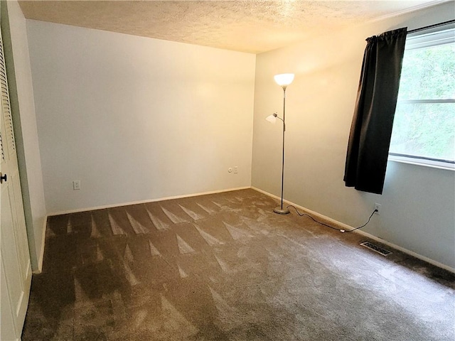 314 Wren Dr, Hempfield Twp Wml, PA 15601 - carpeted spare room with a textured ceiling and baseboards