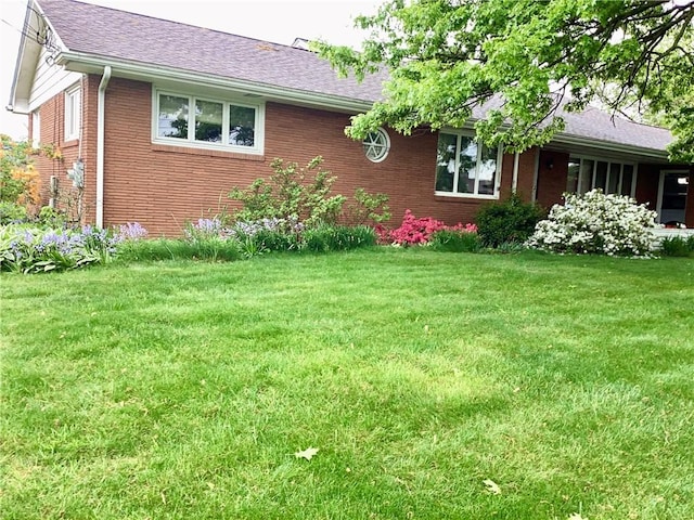 1180 Sunset Dr, Latrobe, PA 15650 - view of property exterior with brick siding and a yard