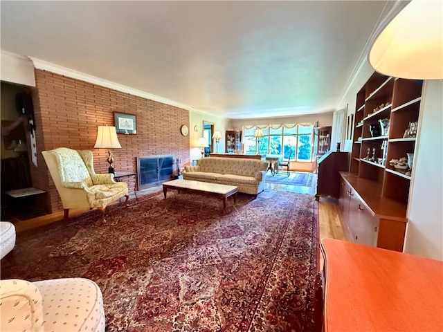 1180 Sunset Dr, Latrobe, PA 15650 - living area featuring brick wall, a fireplace, crown molding, and wood finished floors