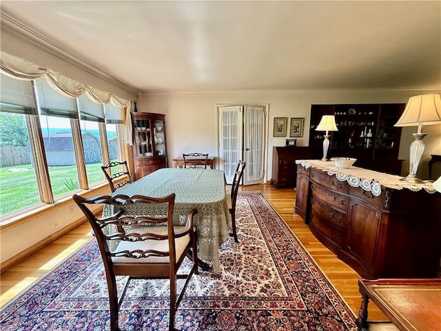 1180 Sunset Dr, Latrobe, PA 15650 - dining space featuring light wood-type flooring and crown molding