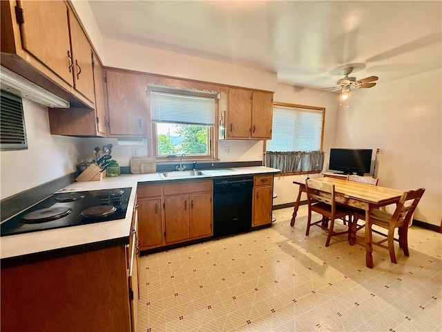 1180 Sunset Dr, Latrobe, PA 15650 - kitchen featuring black appliances, a ceiling fan, light floors, and light countertops