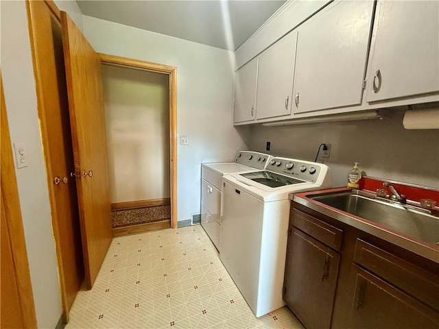 1180 Sunset Dr, Latrobe, PA 15650 - washroom featuring cabinet space, washing machine and dryer, and light floors
