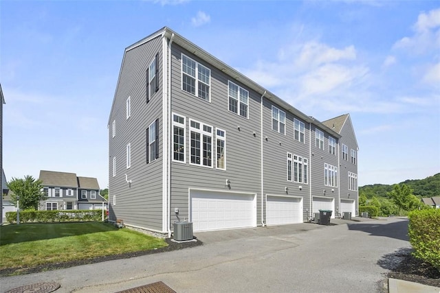 2123 Westcott Ln, South Fayette, PA 15017 - back of house featuring a lawn and an attached garage