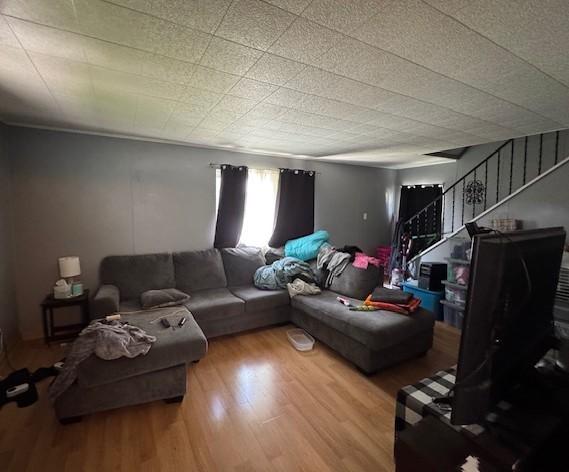 909 N Hickory St, Scottdale, PA 15685 - living room featuring wood finished floors and stairway