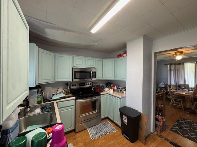 909 N Hickory St, Scottdale, PA 15685 - kitchen featuring stainless steel appliances and light wood-style flooring