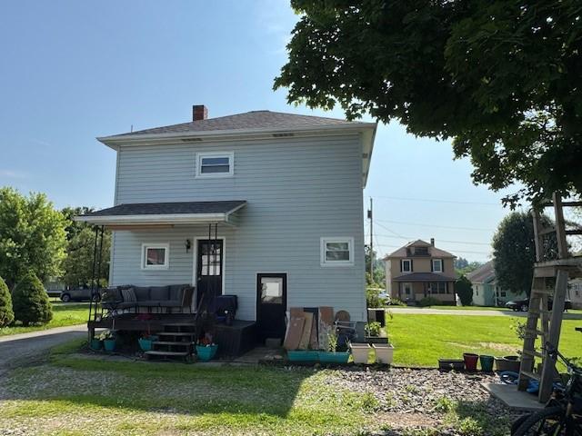 909 N Hickory St, Scottdale, PA 15685 - back of house featuring a yard and a chimney