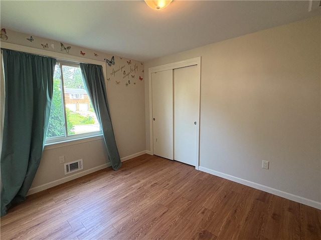 111 Hemlock Ln, Monroeville, PA 15146 - unfurnished bedroom with wood finished floors and a closet