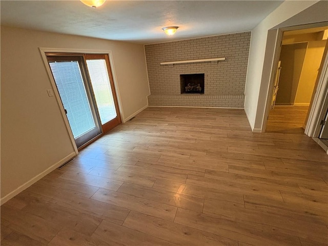 111 Hemlock Ln, Monroeville, PA 15146 - unfurnished living room with a fireplace and wood finished floors