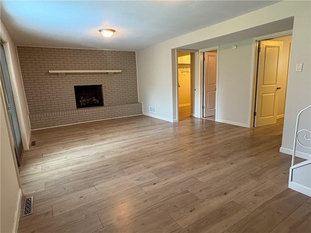 111 Hemlock Ln, Monroeville, PA 15146 - unfurnished living room featuring a fireplace and wood finished floors