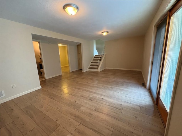 111 Hemlock Ln, Monroeville, PA 15146 - empty room with stairway and light wood-style floors