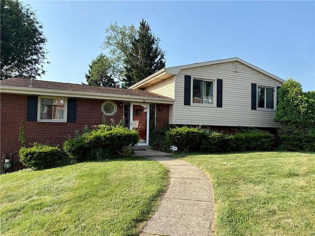 111 Hemlock Ln, Monroeville, PA 15146 - tri-level home featuring a front yard and brick siding