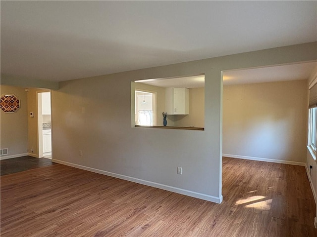 111 Hemlock Ln, Monroeville, PA 15146 - empty room with dark wood-style floors and baseboards