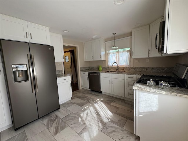 111 Hemlock Ln, Monroeville, PA 15146 - kitchen featuring stainless steel appliances, white cabinets, light stone counters, decorative light fixtures, and recessed lighting