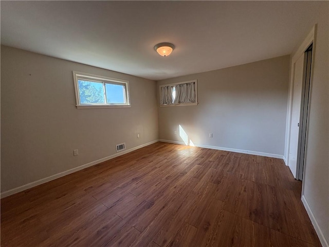 111 Hemlock Ln, Monroeville, PA 15146 - empty room with dark wood-style flooring and baseboards
