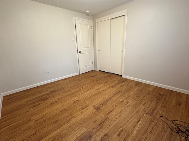 111 Hemlock Ln, Monroeville, PA 15146 - unfurnished bedroom with wood finished floors and a closet
