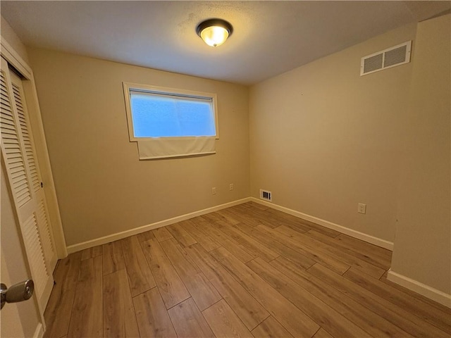 111 Hemlock Ln, Monroeville, PA 15146 - unfurnished bedroom with wood finished floors and a closet