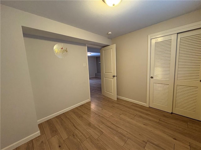111 Hemlock Ln, Monroeville, PA 15146 - unfurnished bedroom featuring wood finished floors and a closet