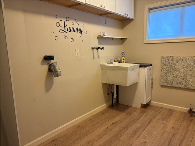 111 Hemlock Ln, Monroeville, PA 15146 - washroom with light wood-style floors and baseboards
