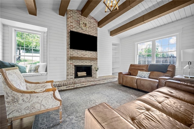 108 Heather Dr, Center Twp Bea, PA 15061 - living room featuring plenty of natural light, a fireplace, wooden walls, and a chandelier