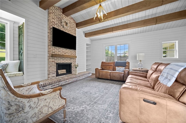 108 Heather Dr, Center Twp Bea, PA 15061 - living area with beam ceiling, a fireplace, and built in shelves