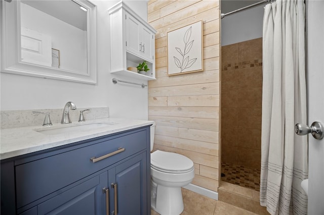 108 Heather Dr, Center Twp Bea, PA 15061 - bathroom featuring vanity, tiled shower, tile patterned flooring, and wooden walls