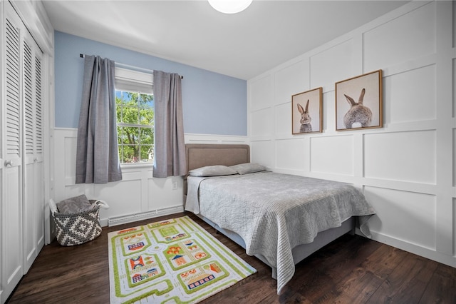 108 Heather Dr, Center Twp Bea, PA 15061 - bedroom with a decorative wall, dark wood-style floors, a baseboard radiator, and a wainscoted wall
