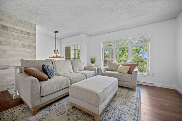 108 Heather Dr, Center Twp Bea, PA 15061 - living room with baseboard heating, wood finished floors, and a textured ceiling