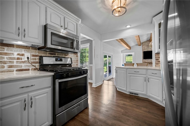 108 Heather Dr, Center Twp Bea, PA 15061 - kitchen featuring stainless steel appliances, healthy amount of natural light, dark wood-style floors, and tasteful backsplash