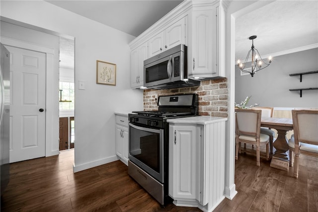108 Heather Dr, Center Twp Bea, PA 15061 - kitchen with stainless steel appliances, white cabinetry, light countertops, decorative backsplash, and a chandelier