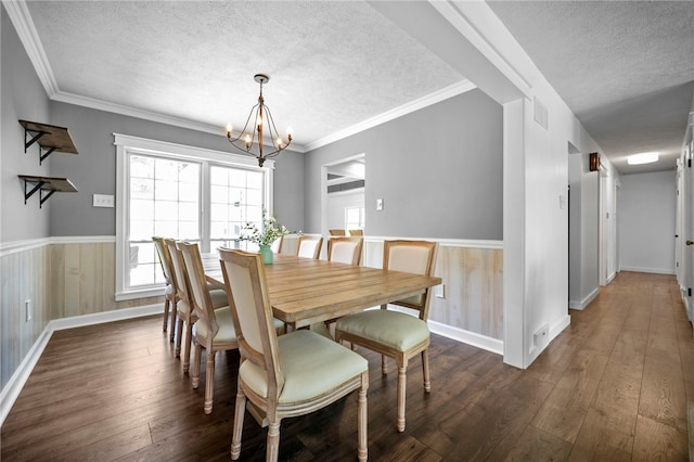 108 Heather Dr, Center Twp Bea, PA 15061 - dining room featuring a textured ceiling, a chandelier, dark wood finished floors, wainscoting, and ornamental molding