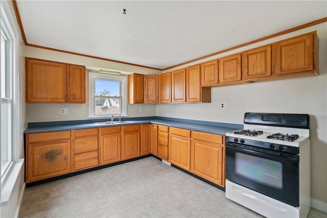 1029 Nimick Ave, Monaca, PA 15061 - kitchen with range with gas stovetop, ornamental molding, and brown cabinetry