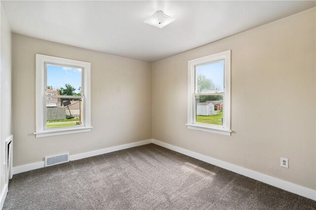 1029 Nimick Ave, Monaca, PA 15061 - empty room with healthy amount of natural light and carpet flooring